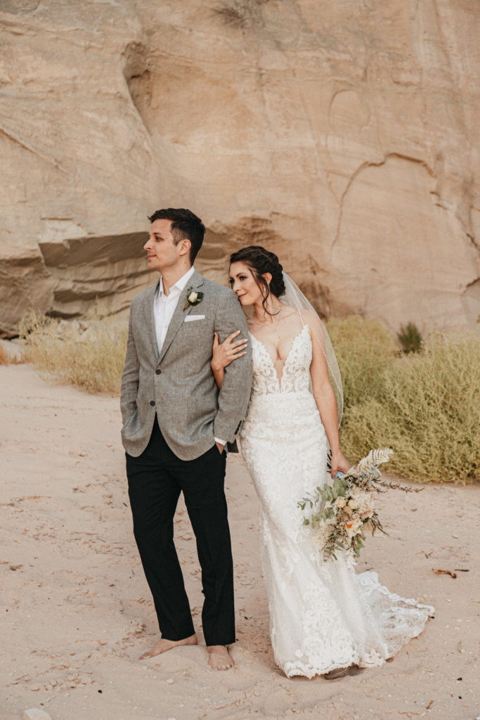 Couple posing in canyon for adventure elopement in Lake Powell, AZ
