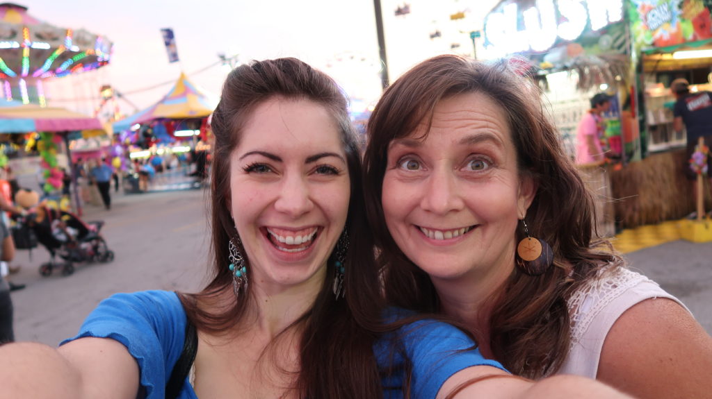 mother and daughter laughing at western fair market Carnival in London Ontario